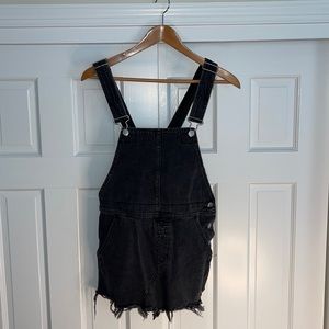 Black Free People denim dress with distressed hem.